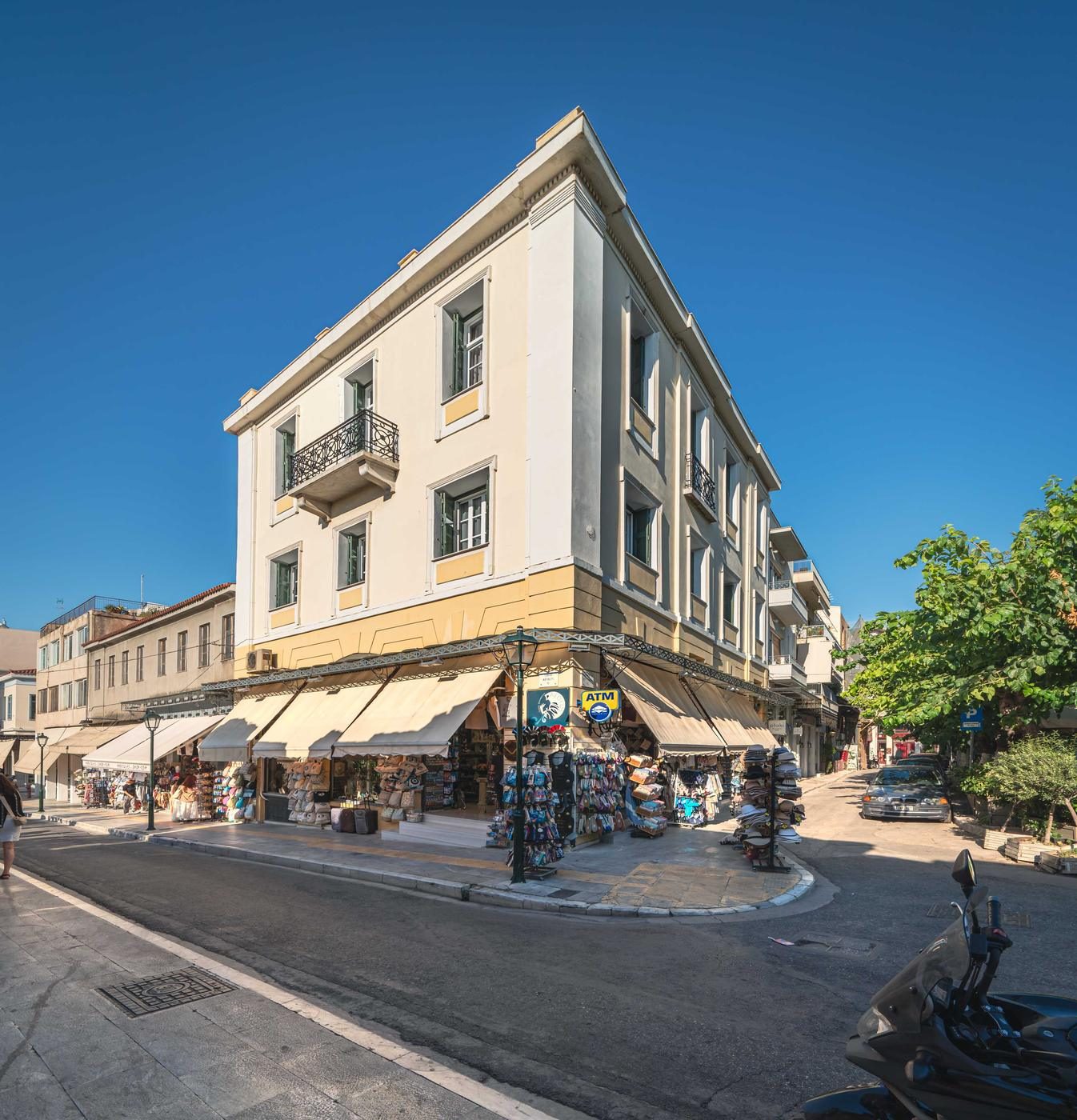 The yellow Plaka house of The Aeolian on a street corner